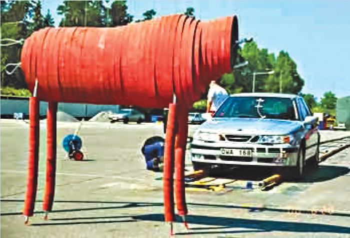A moose crash test dummy and a car.