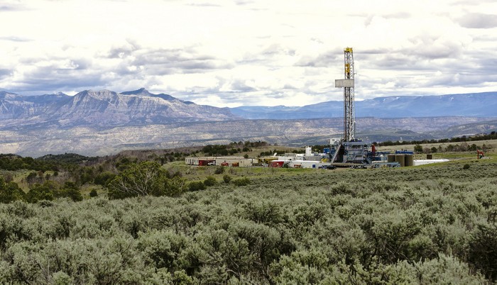 A drilling platform near Grand Junction, Colorado, with mountains in the background.