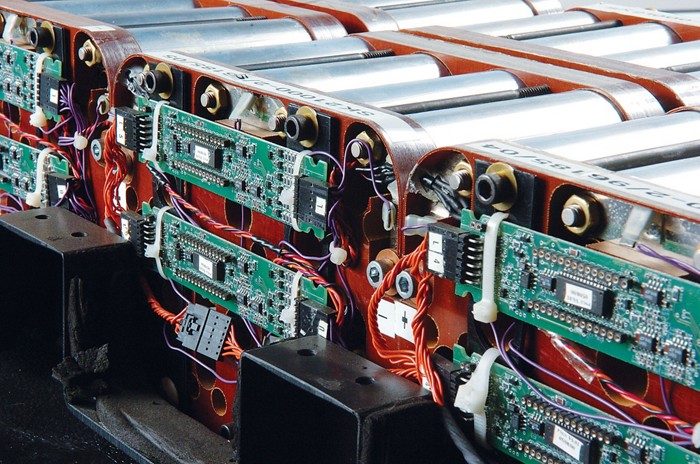This photo shows an electric-car battery made up of dozens of battery cells. 09615-cover1-batteriescxd.jpg