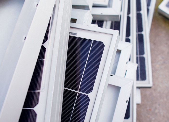 Image of old solar panels in a bin to be recycled. 09615-cover1-solarpanelscxd.jpg