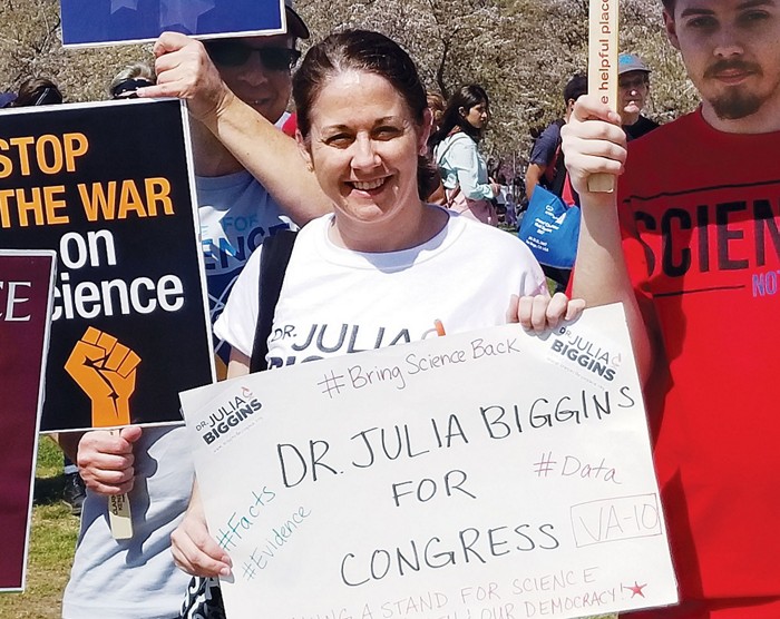 Woman running for Congress surrounded by supporters at the March for Science. 09622-feature1-Bigginscxd.jpg