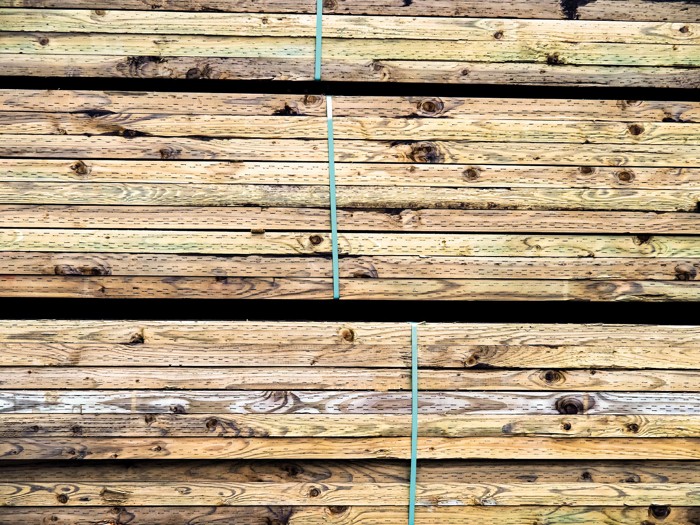 What is pressuretreated lumber, and how does it forestall decay?